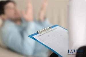 Practitioner holding a medical information form for an injury claim.